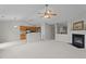 Spacious living room with eat in kitchen, fireplace, and neutral colors at 4408 Jordan Oaks Way, Raleigh, NC 27604