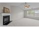 Spacious living room with vaulted ceiling, a fireplace, and lots of natural light at 4408 Jordan Oaks Way, Raleigh, NC 27604