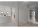 Bright living room featuring neutral paint, tile flooring leading to kitchen, and tons of natural light at 4408 Jordan Oaks Way, Raleigh, NC 27604