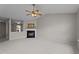 Spacious living room featuring a fireplace, ceiling fan, and neutral paint at 4408 Jordan Oaks Way, Raleigh, NC 27604