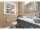 Bathroom featuring tiled floor, vanity with marble counter, and modern mirror at 4521 Chicopee Trl, Durham, NC 27707