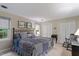 Comfortable bedroom with a large bed, windows, and closet space at 4521 Chicopee Trl, Durham, NC 27707