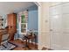 Entryway with blue walls, hardwood floors, traditional decor, and a glimpse of a well-lit interior at 4521 Chicopee Trl, Durham, NC 27707
