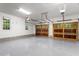 Spacious garage with two wood paneled doors and a window offering natural light at 4521 Chicopee Trl, Durham, NC 27707