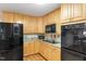 Kitchen with granite counters, stainless steel refrigerator, and microwave at 4521 Chicopee Trl, Durham, NC 27707