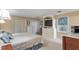Spacious main bedroom with white built-ins and carpeted floor at 4521 Chicopee Trl, Durham, NC 27707