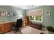 Bright office featuring a built-in desk, natural light, and green walls at 4521 Chicopee Trl, Durham, NC 27707