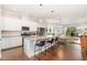 Modern kitchen with a center island, stainless steel appliances, white cabinetry, and an open layout at 47 Coventry Ln, Chapel Hill, NC 27516