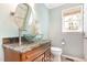 Bathroom featuring a granite countertop, a glass vessel sink, and a wooden vanity at 500 Hunters Ridge Dr, Fuquay Varina, NC 27526
