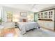 Bedroom featuring a queen bed, ceiling fan, and a built-in display cabinet at 500 Hunters Ridge Dr, Fuquay Varina, NC 27526