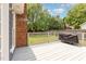 This gray wood deck has a grill with an enclosed backyard and privacy fence at 500 Hunters Ridge Dr, Fuquay Varina, NC 27526