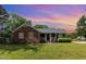 Charming home featuring brick and siding, a manicured lawn, and a cozy front porch, creating a welcoming curb appeal at 500 Hunters Ridge Dr, Fuquay Varina, NC 27526