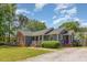 View of home featuring brick and siding, landscaped yard, and cozy front porch, creating a welcoming curb appeal at 500 Hunters Ridge Dr, Fuquay Varina, NC 27526