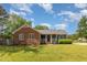 Charming home featuring brick and siding, a manicured lawn, and a cozy front porch, creating a welcoming curb appeal at 500 Hunters Ridge Dr, Fuquay Varina, NC 27526