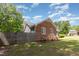 Home's exterior is brick and siding with white trim. A wooden privacy fence is visible at 500 Hunters Ridge Dr, Fuquay Varina, NC 27526