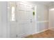 Bright foyer featuring a white front door with sidelights and durable tile flooring at 500 Hunters Ridge Dr, Fuquay Varina, NC 27526