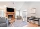 Bright living room with vaulted ceilings, brick fireplace, neutral paint, and stylish decor at 500 Hunters Ridge Dr, Fuquay Varina, NC 27526