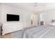 Bright main bedroom with en suite bathroom access, a large dresser, and a ceiling fan at 500 Hunters Ridge Dr, Fuquay Varina, NC 27526