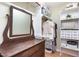 Organized walk-in closet featuring shelves and a dresser with a large mirror at 500 Hunters Ridge Dr, Fuquay Varina, NC 27526