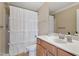 Clean bathroom with a shower, white vanity, a toilet, and large mirror at 5003 Blue Jack Oak Dr, Cary, NC 27519