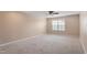 Spacious bedroom featuring neutral paint, carpet and a ceiling fan at 5003 Blue Jack Oak Dr, Cary, NC 27519