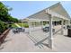 This beautiful community amenity features a white pergola with green picnic tables for residents to enjoy at 5003 Blue Jack Oak Dr, Cary, NC 27519