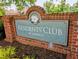 The brick sign at Amberly's Residents' Club, showcasing beautiful landscaping around this sought-after neighborhood at 5003 Blue Jack Oak Dr, Cary, NC 27519