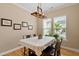 Cozy dining room with natural light, a wooden table, and decorative artwork on the walls at 5003 Blue Jack Oak Dr, Cary, NC 27519