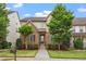 Charming two-story home with a stone facade, landscaped yard, and a welcoming entrance at 5003 Blue Jack Oak Dr, Cary, NC 27519