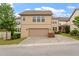 Home's garage showcasing a wide paved driveway and low-maintenance landscaping at 5003 Blue Jack Oak Dr, Cary, NC 27519