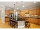 Modern kitchen featuring granite countertops, stainless steel appliances, and a central island at 5003 Blue Jack Oak Dr, Cary, NC 27519