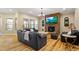 Inviting living room with a stone fireplace, hardwood floors, and cozy seating at 5003 Blue Jack Oak Dr, Cary, NC 27519
