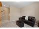 Neutral living room with large window, with carpet floors, sofa and ottoman at 5003 Blue Jack Oak Dr, Cary, NC 27519