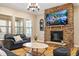 Beautiful living room featuring a stone fireplace and hardwood floors at 5003 Blue Jack Oak Dr, Cary, NC 27519
