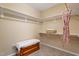 Spacious walk-in closet featuring shelving, hanging rods, and cedar chest for ample storage space at 5003 Blue Jack Oak Dr, Cary, NC 27519