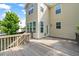 Exterior backyard deck featuring a light colored home in the background at 5011 Peachtree Town Ln, Knightdale, NC 27545