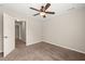 Cozy bedroom with ceiling fan, carpeted floor, and neutral paint at 5011 Peachtree Town Ln, Knightdale, NC 27545