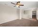 Spacious bedroom featuring a ceiling fan and neutral carpeting at 5011 Peachtree Town Ln, Knightdale, NC 27545