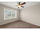 Charming bedroom with a ceiling fan and large window with natural light at 5011 Peachtree Town Ln, Knightdale, NC 27545