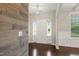Elegant foyer featuring hardwood floors and an accent wall at 5011 Peachtree Town Ln, Knightdale, NC 27545