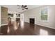Spacious room showing fireplace, hardwood floors, and kitchen access at 5011 Peachtree Town Ln, Knightdale, NC 27545