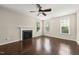 Bright living room features a fireplace and multiple windows for natural light at 5011 Peachtree Town Ln, Knightdale, NC 27545