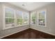 Light-filled sunroom with hardwood floors and views of the outdoors at 5011 Peachtree Town Ln, Knightdale, NC 27545