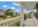 Neighborhood view from the home's porch area with black metal railings at 5011 Peachtree Town Ln, Knightdale, NC 27545