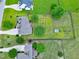 Aerial view of a house with a large fenced yard, featuring a fire pit and storage shed at 5016 Swordfish Dr, Raleigh, NC 27603