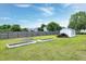 Large backyard with a storage shed and raised garden beds ready for planting at 5016 Swordfish Dr, Raleigh, NC 27603