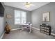 Bedroom with carpet, ceiling fan, desk, and decorative llama themed picture on the wall at 5016 Swordfish Dr, Raleigh, NC 27603