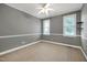 Bedroom featuring neutral walls, white trim, carpeted floors, and a ceiling fan at 5016 Swordfish Dr, Raleigh, NC 27603