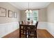 Comfortable dining room with hardwood floors, natural light and decorative light fixtures at 5016 Swordfish Dr, Raleigh, NC 27603