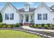 Eye-catching home with manicured landscaping that frames the sidewalk leading to the welcoming front porch at 5016 Swordfish Dr, Raleigh, NC 27603
